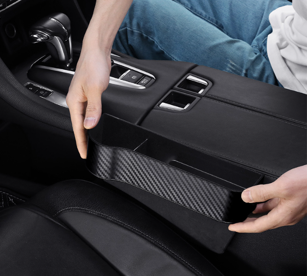 Car organizer storage compartment between the seats L